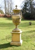 A large and impressive Swedish stone composition garden urn on plinth