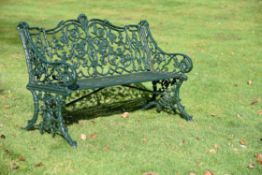 A Victorian green painted garden bench