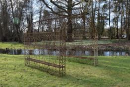 A large wrought iron seat arbour