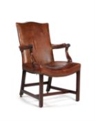 A George III mahogany and leather upholstered open armchair