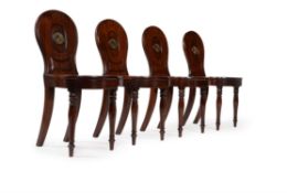 A set of four Regency mahogany hall chairs