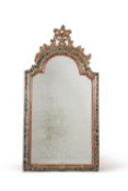 A Continental carved, silvered and painted wall mirror, mid 18th century