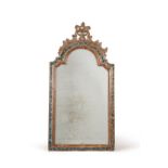 A Continental carved, silvered and painted wall mirror, mid 18th century