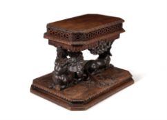 A carved oak jardinière table, third quarter 19th century and later