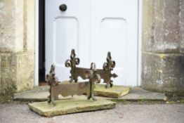 A pair of English limestone and wrought iron mounted bootscrapes, 19th century