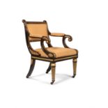 A Regency ebonised and parcel gilt open armchair