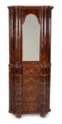 A figured walnut corner cupboard, second quarter 18th century