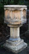 A Victorian terracotta garden font in Gothic Revival style