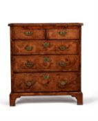 A Queen Anne walnut, burr walnut and feather banded bachelor's chest of drawers