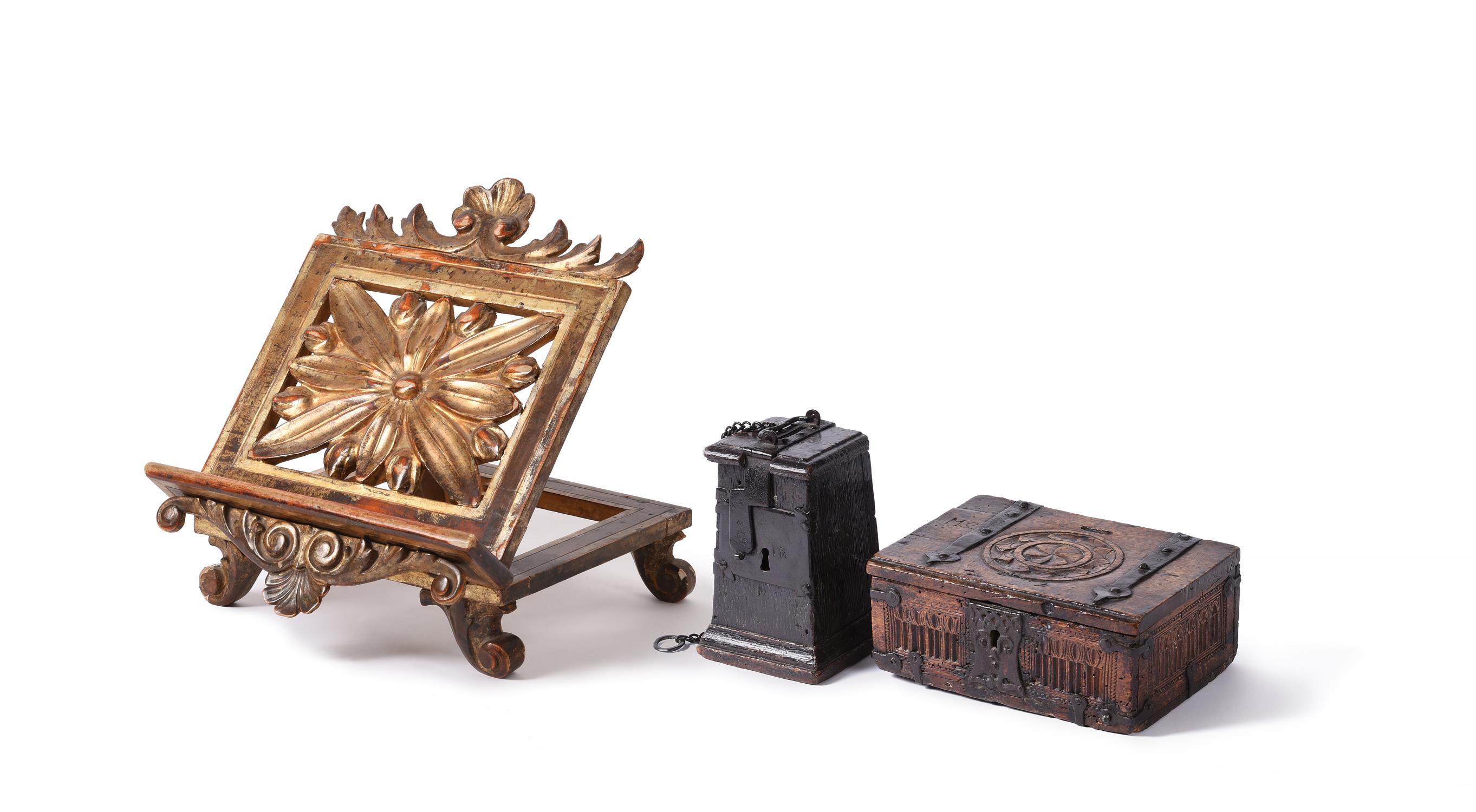 A North European carved oak and wrought iron bound offertory or alms box, 17th century