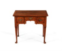 A George II walnut and crossbanded side table or lowboy, circa 1735