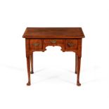 A George II walnut and crossbanded side table or lowboy, circa 1735