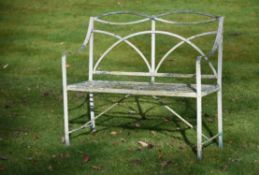 A Regency white painted wrought iron garden bench