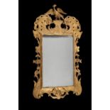 A George III giltwood and gesso wall mirror