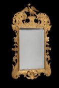 A George III giltwood and gesso wall mirror