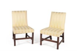 A pair of George III mahogany and upholstered side chairs