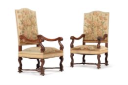 A pair of walnut and tapestry upholstered open armchairs, in Louis XIV style, mid 19th century