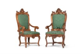 A pair of Continental carved walnut armchairs, , first half 18th century