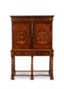 A William and Mary walnut and marquetry cabinet on stand