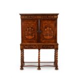 A William and Mary walnut and marquetry cabinet on stand