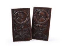 A pair of French or English sculpted oak Romayne panels, mid-16th century