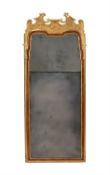 A George II gilt gesso and walnut wall mirror