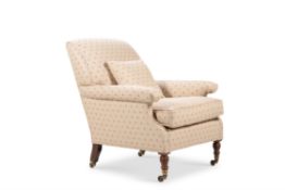 A Victorian walnut and upholstered armchair by Howard & Sons