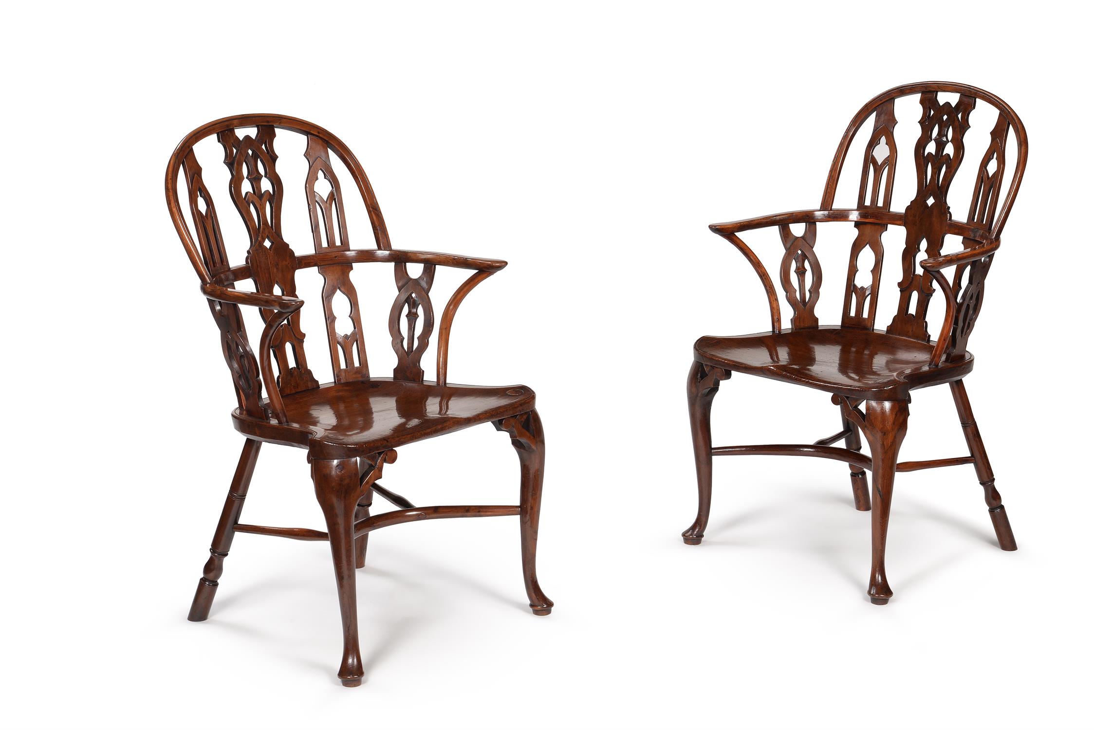A pair of yew and mahogany Gothic Windsor armchairs