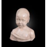 An Italian sculpted white marble portrait bust of a young boy