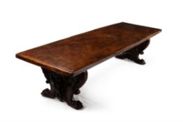 An elm and walnut dining table, of refectory type, in 17th century Italian style