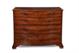 A George III mahogany and crossbanded serpentine fronted chest of drawers