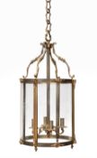 A gilt metal and glazed cylindrical hall lantern