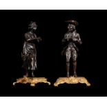 A pair of French bronze models of peddlers