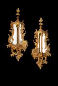 A pair of George III carved giltwood and gesso wall mirrors