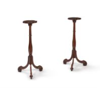 A pair of George III mahogany torchere stands
