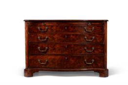 A George III mahogany serpentine fronted commode