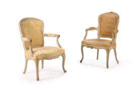 A George III cream painted and parcel gilt open armchair