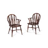 A matched pair of yew and elm Windsor armchairs