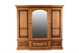 A Victorian ash and birch breakfront wardrobe