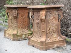 A pair of French cast iron pedestals