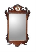 A George II mahogany and parcel gilt wall mirror