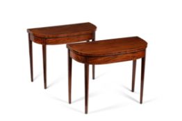 A pair of George III mahogany and line inlaid folding card tables