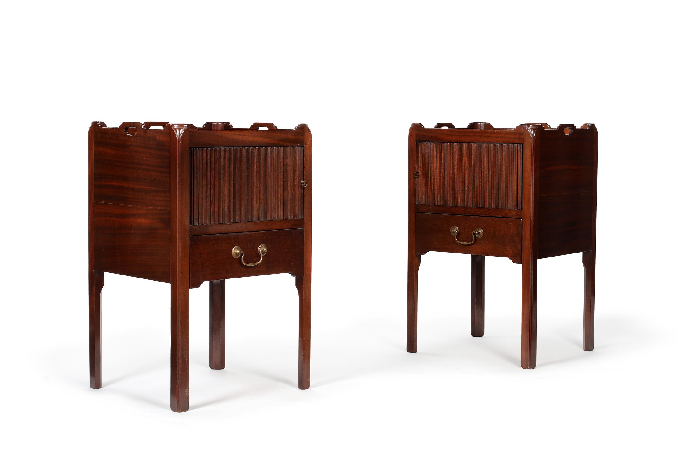 A pair of mahogany bedside cupboards