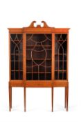 An Edwardian satinwood and marquetry display cabinet