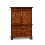 A Queen Anne walnut and feather banded cabinet on chest, circa 1710