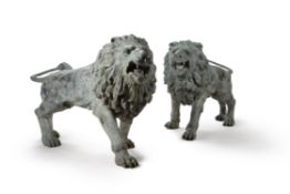 A pair of impressive verdigris patinated bronze models of roaring lions, late 20th century