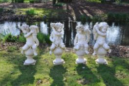 A set of four sculpted white marble models of putti