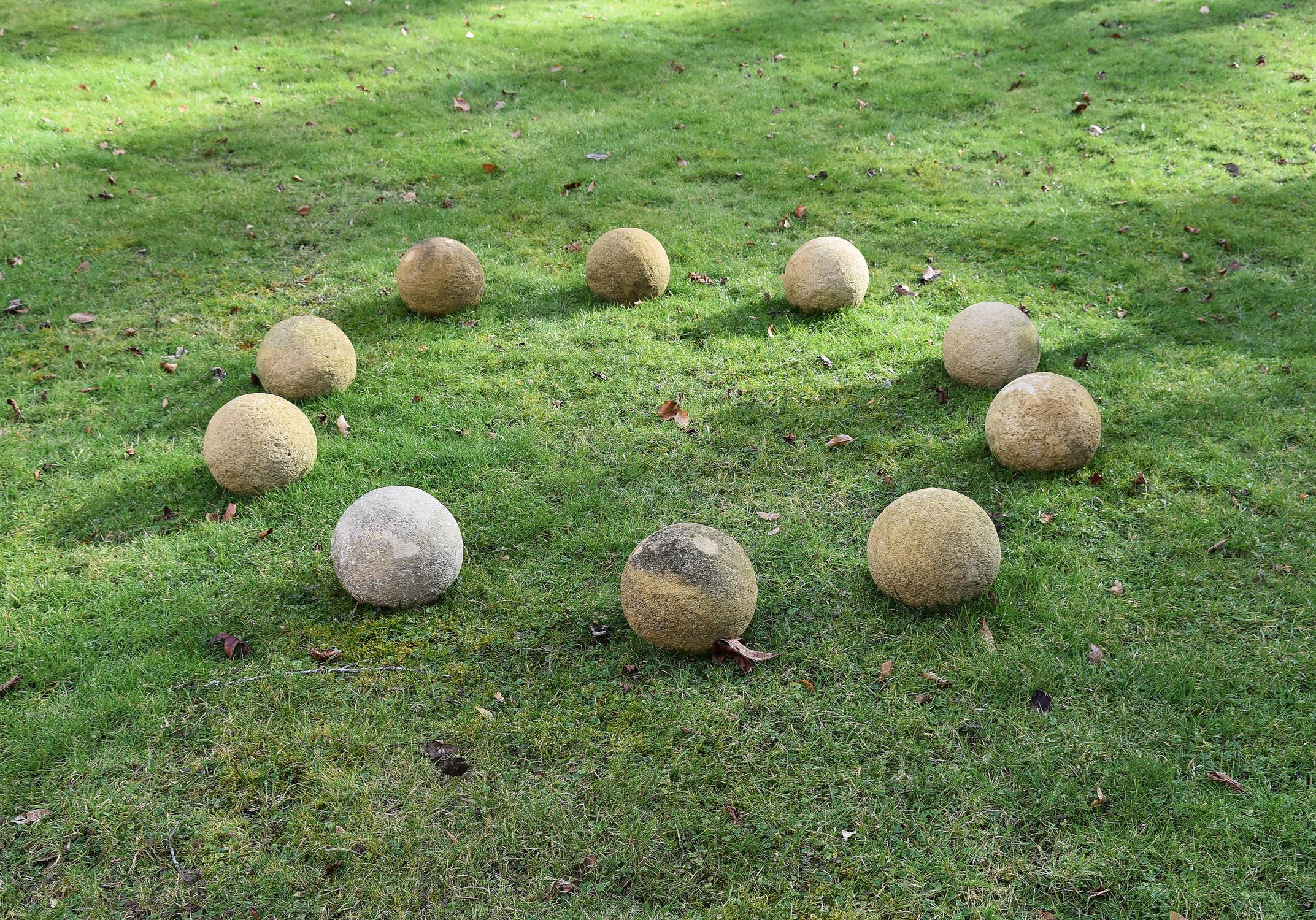 A set of ten stone garden spheres