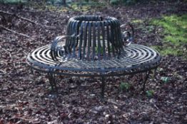 A patinated metal park or tree seat