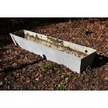 A white painted iron trough